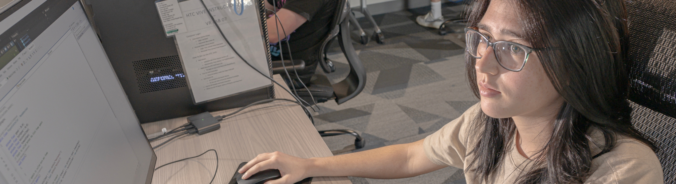 student studying computer monitor