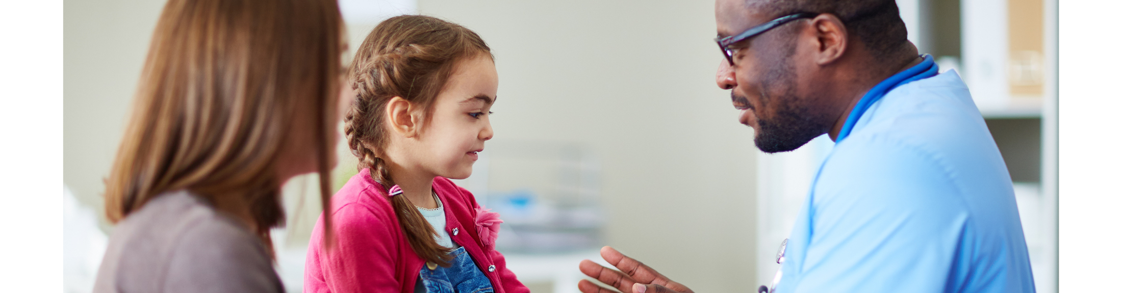 nurse providing care to a child and parent