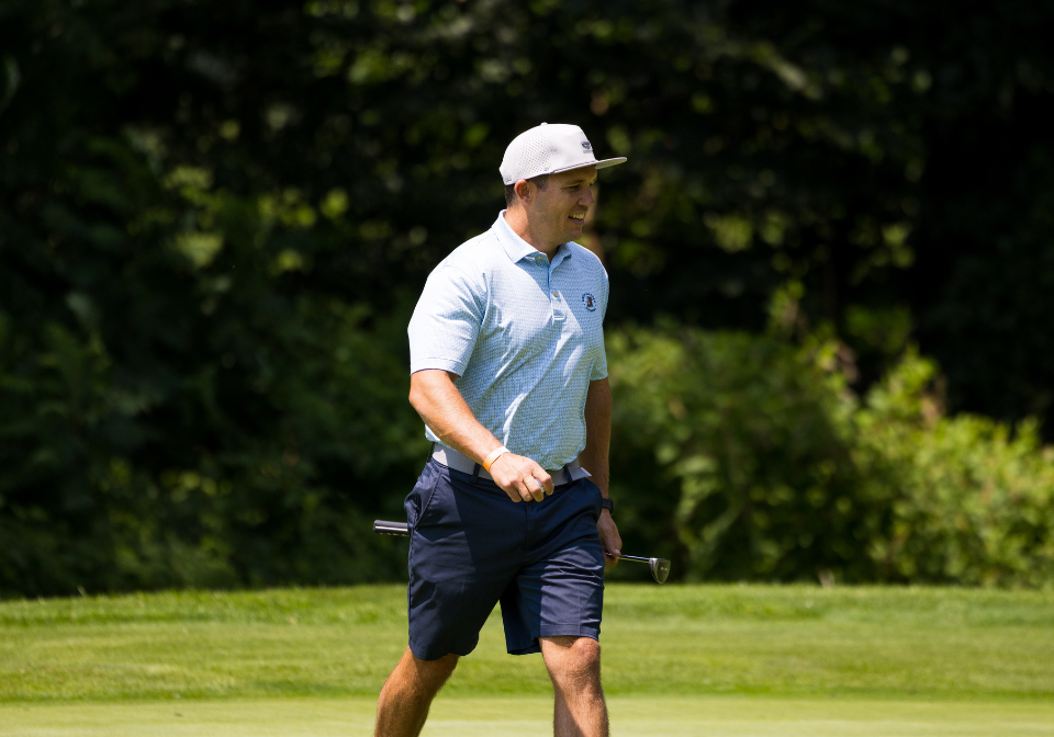 man celebrates on the golf course