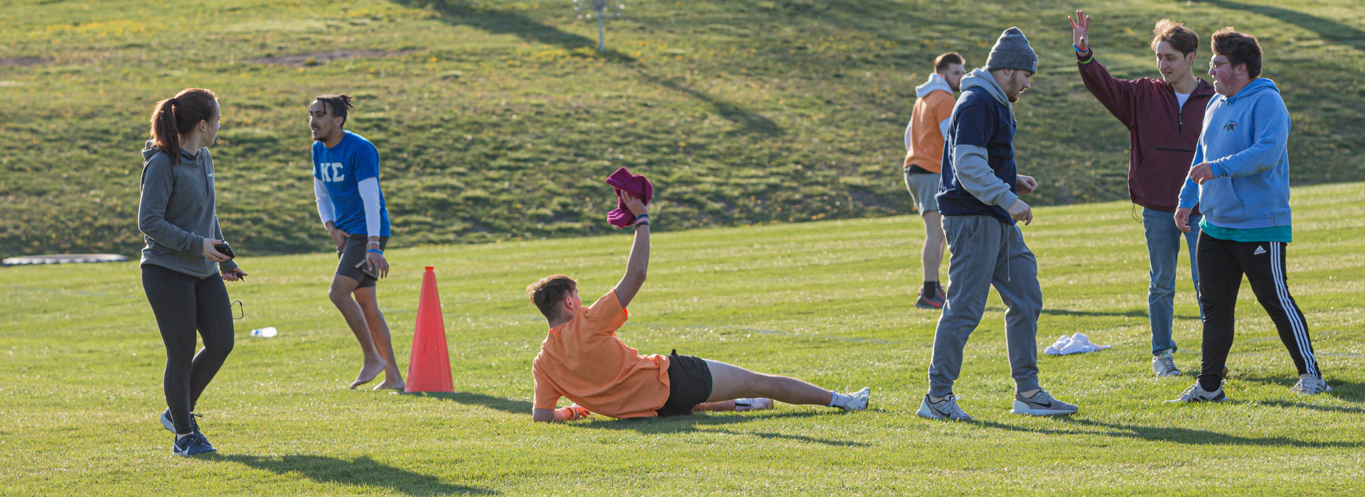 students playing flag football outside