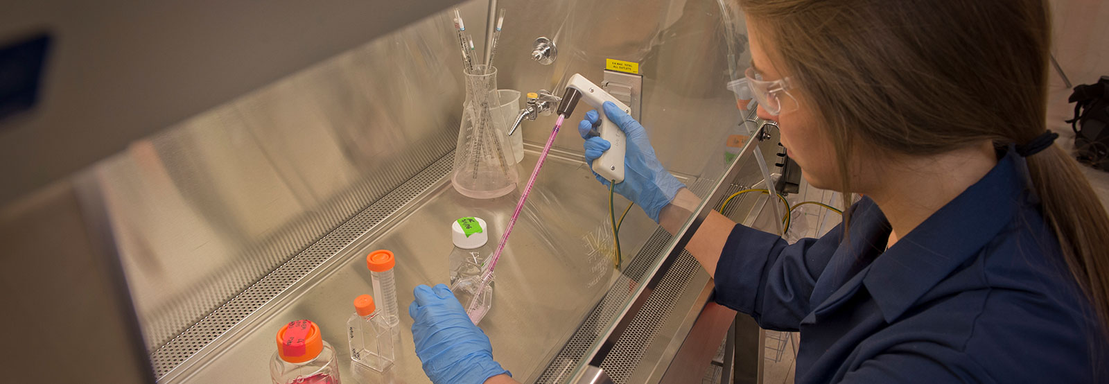 Student measuring liquid