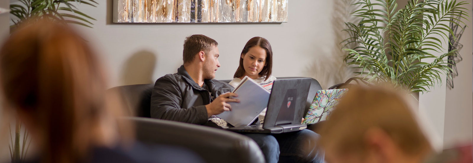 Two students studying in lounge