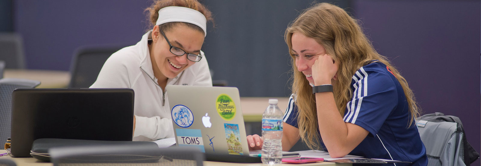 Two students studying in the library