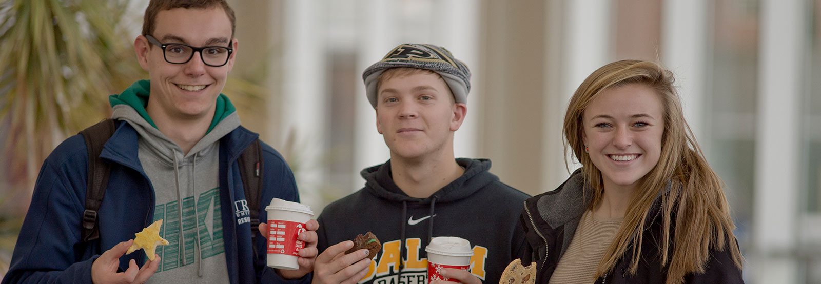 Three students enjoying hot cocoa