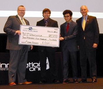 The team that is developing VibeSense accepts the $2,500 top prize in the Technology category of the Innovation Challenge expo Friday at Trine University. Pictured, from left, are Jason Blume, executive director of Innovation One; Braden Hale, a freshman electrical engineering major from Austin; Animesh Kunwar, a freshman biomedical engineering major from Santa Rosa, California; and Kevin Hipskind, market president for Fifth Third Bank, Central and Northeastern Indiana.