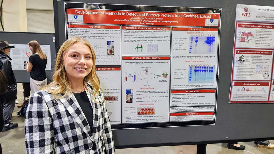 Trine University student presenting research poster