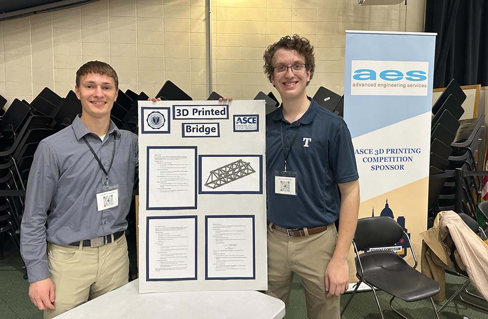 Civil engineering students with display board
