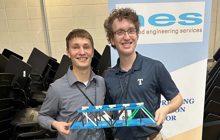 Students with 3D-printed bridge