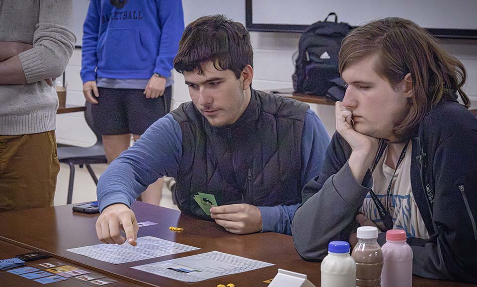 Two students playing board game