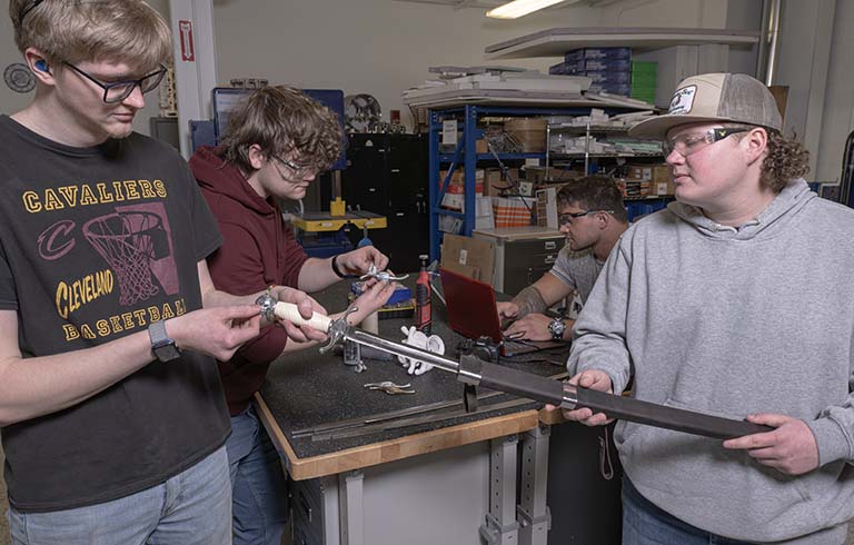 Students with sword for Cast in Steel competition
