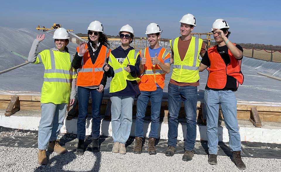Trine University civil engineering students standing near bridge deck