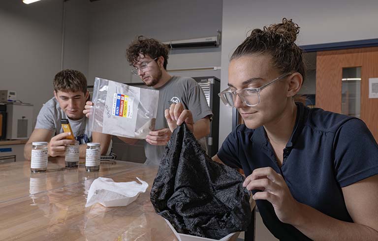 Senior design team that developed a more efficient soot recovery system