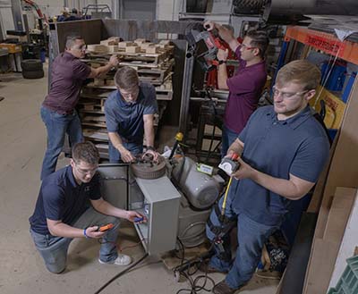 Team of students with Dexter Axle senior design project