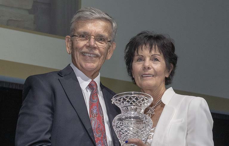 Dr. Brooks and Kathy Eikenberry with the Woman of Distinction Award