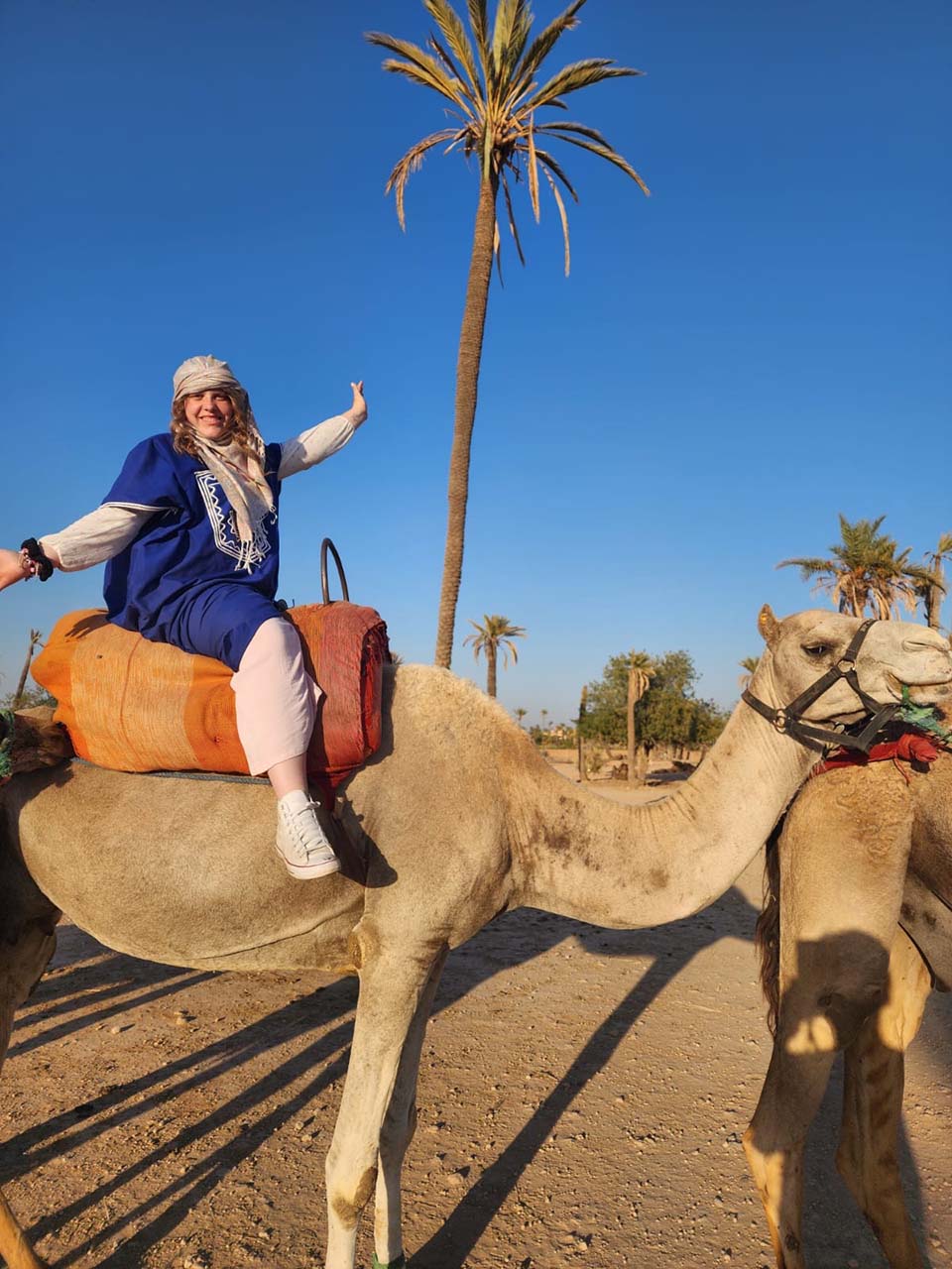 Mackenzie Rosenau on a camel in Morocco
