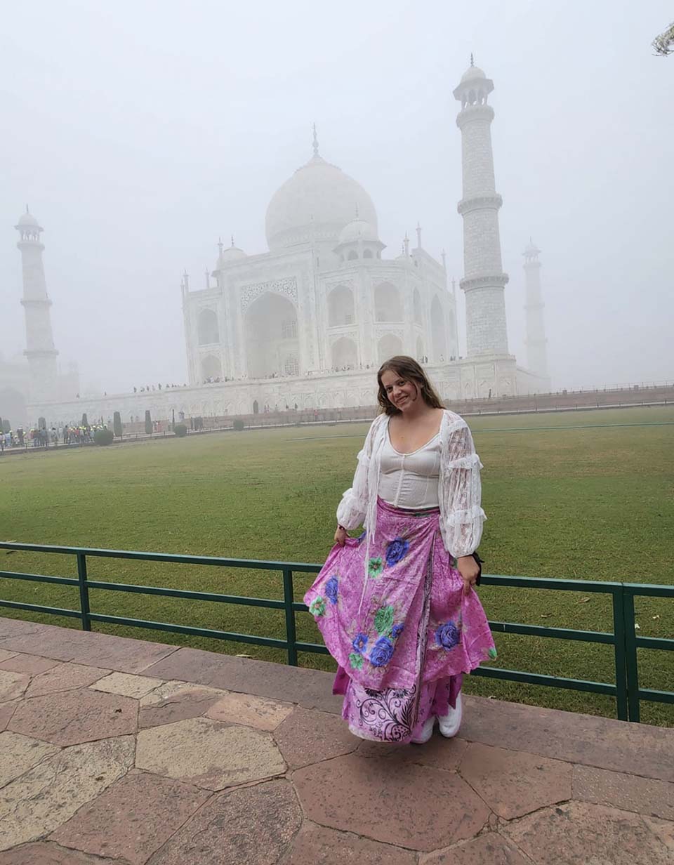 Mackenzie Rosenau in front of the Taj Mahal