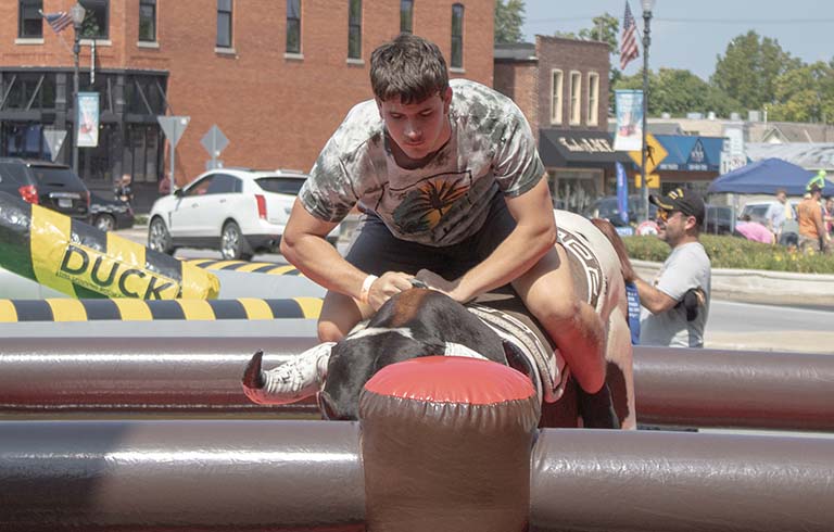 Student on mechanical bull at Trine Fest