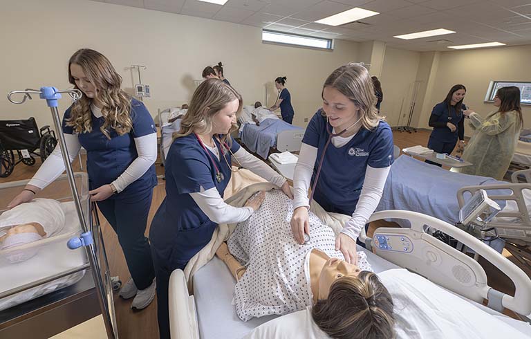 Trine University nursing students practicing skills