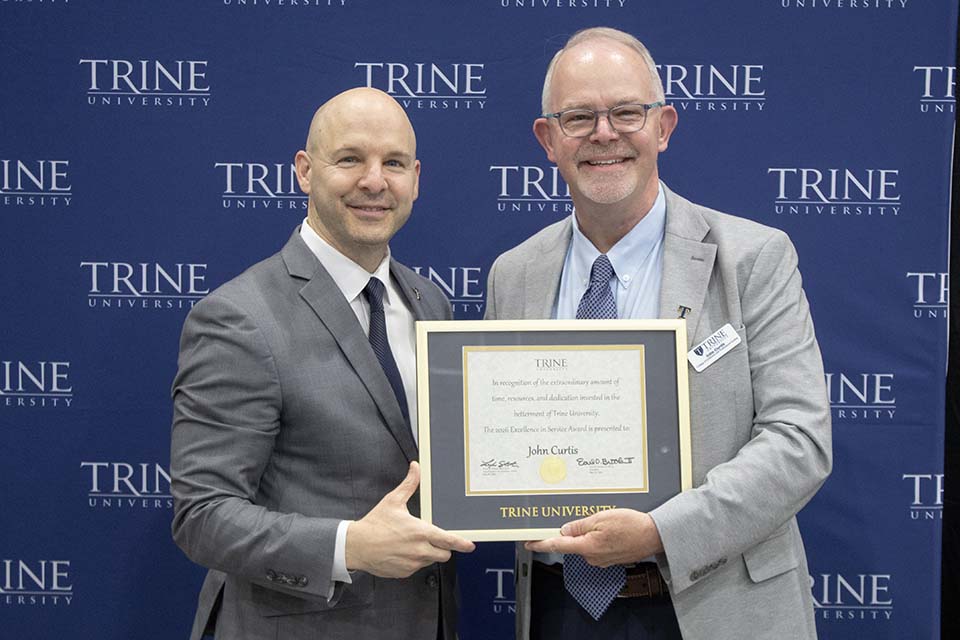 Dr. Kline presents award to John Curtis