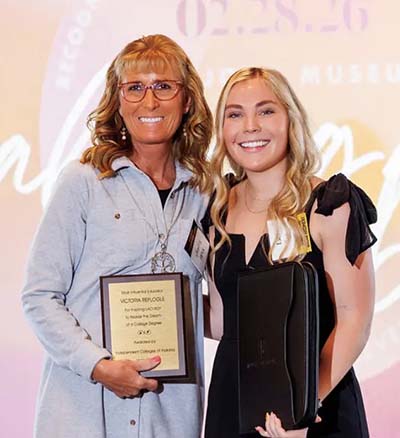 Victoria Replogle holding award, and Laci Roy