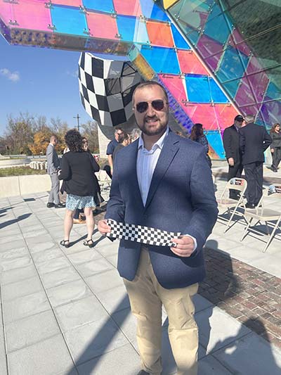 Russel Reynolds with checkered ribbon