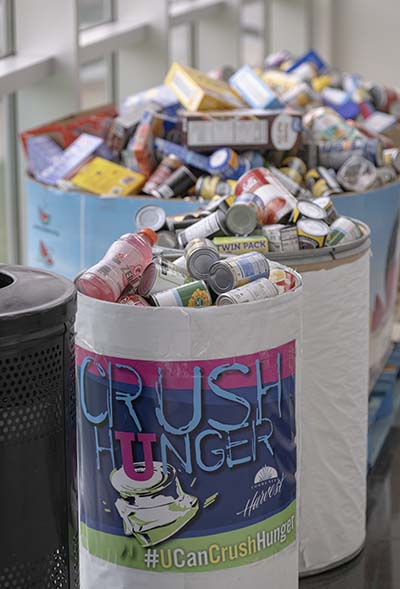 Bins overflowing with canned and boxed food