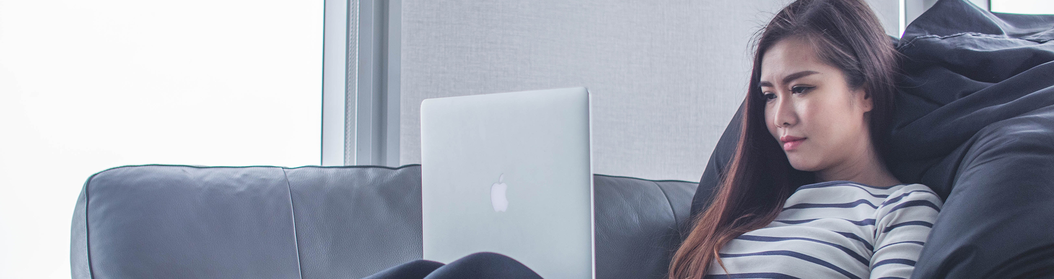 Female relaxing with laptop