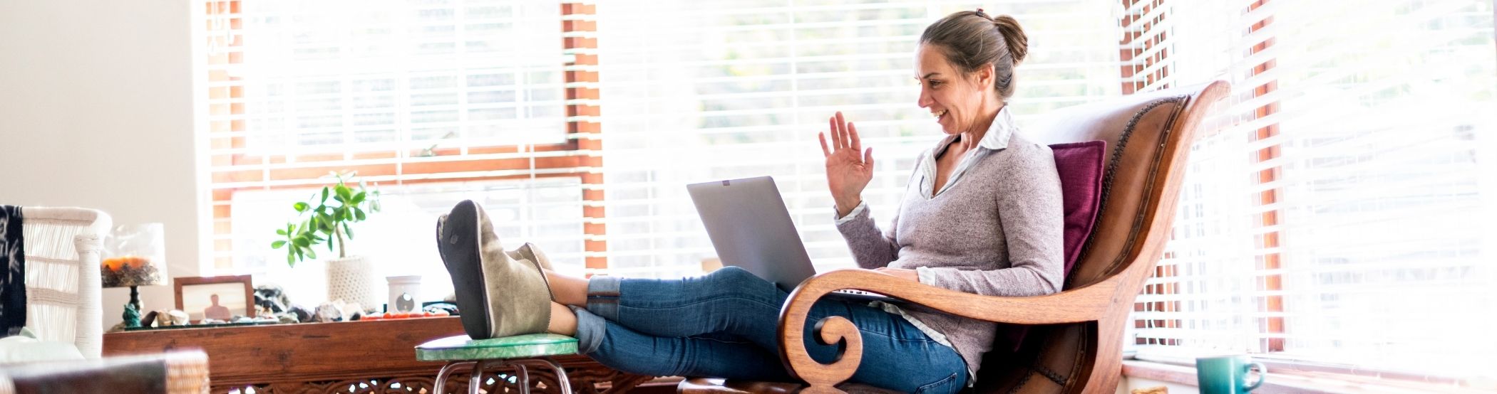 Female on laptop in her living room